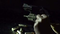 Slow Motion of loading Bullet into Revolver Stock Footage