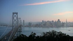 Commuter traffic crosses the Bay Bridge into San Francisco early in the day. Stock Footage