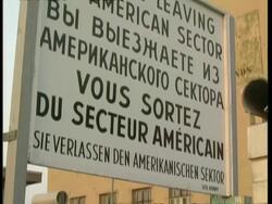 CU Checkpoint charlie, Tilt up to multilingual sign, 'You are now leaving the American sector', Berlin Stock Footage