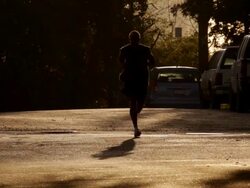 Runner in early morning light Stock Footage