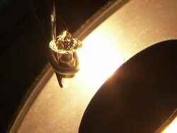 A lamp illuminates a gem in front of it. Stock Footage
