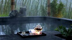 elegant tea set near spa pool outdoors Stock Footage