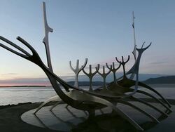 WS Shot of Solfario 'the sun voyager' sculpture in reykjavik in front of ocean at sunset / Reykjavik, Borgarfjaroarsysla, Iceland Stock Footage