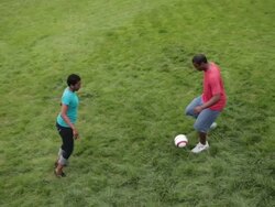 MS Woman and man playing soccer on lawn / Portland, Oregon, United States Stock Footage