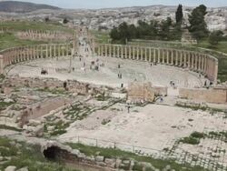 The roman forum at the Greco-Roman ruins in the Jordanian city of Jerash from above Stock Footage