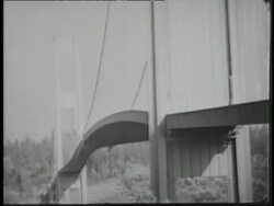 The Tacoma Narrows Bridge twists and buckles  in high winds. Stock Footage
