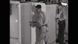MS PAN Men working on refrigerator in factory / United States Stock Footage