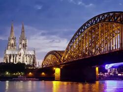 WS ZI T/L View of Cologne Cathedral with Hohenzollern Bridge and Rhine river at dusk / Cologne, North Rhine Westphalia, Germany    Stock Footage