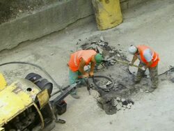 Road Workers with Jackhammer Stock Footage