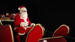 DOLLY HD: Father Christmas waving from his Sleigh Stock Footage