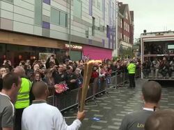 Lewis Hamilton is the first torch relay runner as Stock Footage