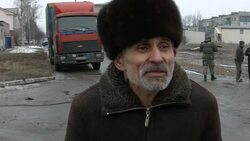 CLEAN : Buses take civilians from Ukraine town after truce agreed News Clip