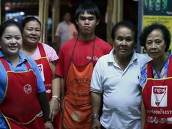 MS Couple who own restaurant with three employees posing and smiling inside restaurant /  Vang Vieng, Vientiane, Laos Stock Footage