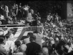 1952: DWIGHT D. EISENHOWER SPEECH: SIDE MS U.S. Republican presidential candidate Dwight 'Ike' Eisenhower speaking about inflation, housewives, people at rally crowded around stage. Campaign, speech, political rally, politics Instructional Video