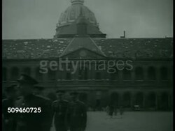 1938: PARIS, FRANCE: WS Arc de Triomphe du Carrousel (not Arc de Triomphe, Arch of Triumph) w/ soldiers standing, traffic FG. Army officers walking outside. INT Czechoslovakian officers sitting at table talking w/ other officers. Instructional Video