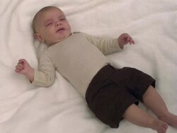 MS SLO MO shot of Caucasian baby boy on blanket, crying / Stanford, Connecticut, United States Stock Footage