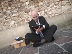 HD DOLLY: Unemployed Businessman Using Tablet Stock Footage