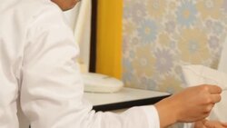 Doctor Taking Temperature of senior patient Stock Footage