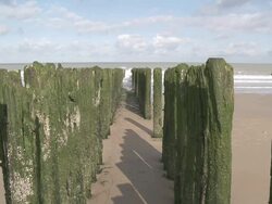 CU View of wave breaker at beach of Knokke / Ostend, Flanders, Belgium Stock Footage