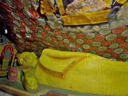 RECLINING BUDDHA AT ALUVIHARA ROCK CAVE TEMPLE Stock Footage