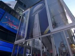 Superbowl fans looking at trophy in Times Square News Clip