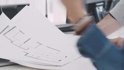 Businessman and businesswoman discussing about blueprints Stock Footage