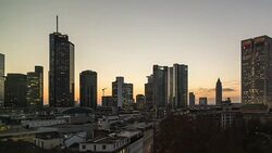 A winter day to night time lapse of central Frankfurt am Main, Germany, featuring multiple skyscrapers lighting up after dark Stock Footage