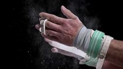 SLO MO Male gymnast clapping wrapped hands Stock Footage