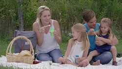 Blowing Bubbles in the Park Stock Footage