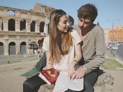 Tourists with guide and map in front of the Coliseum Stock Footage