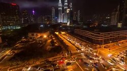 Busy road at night at Petronas Towers. Stock Footage