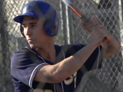 A young man practicing baseball at the batting cages.  - Slow Motion Stock Footage