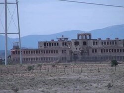 (HD1080i) Crime: Abandoned Prison in Barren Desert, Zoom Out Stock Footage
