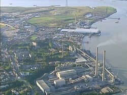 Aerial view of heavy industry on river. NTSC, PAL Stock Footage