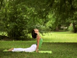 Young woman doing yoga exercise Stock Footage