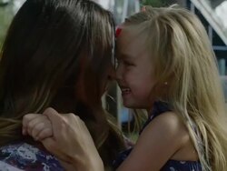 Close up of mother and daughter rubbing noses at carnival / American Fork, Utah, United States Stock Footage
