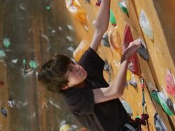 boy on an indoor climbing wall Stock Footage