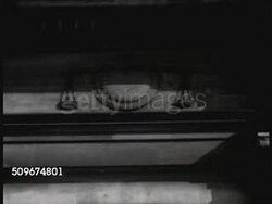 1942: OCCUPIED FRANCE: WS Ministre de la Justice (Minister of Justice) building in Paris. WS Scales of Justice carving on building. VS INT Court of the Provisional (Occupied) Government w/ unidentified men in robes, before bench, HA Sitting at table. Instructional Video