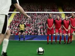 Footballer takes and free kick, goalkeeper makes a save Stock Footage