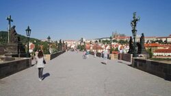 Pedestrians cross the Charles Bridge in Prague. Stock Footage