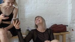 Happy female ballet dancers using mobile phones at rehearsal studio Stock Footage