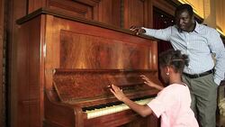 Father and Daughter play piano Stock Footage