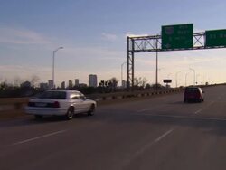 POV, Car driving on highway, city skyline in background, New Orleans, Louisiana, USA Stock Footage