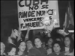 B/W 1962 close up crowd of women holding poster + singing at demonstration / Cuban Missile Crisis Stock Footage