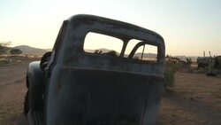A derelict truck rusts in the Namib Desert. Stock Footage