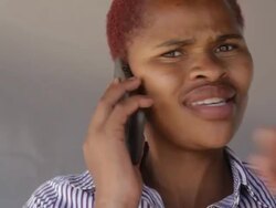 Close up of an african woman talking on the phone Stock Footage