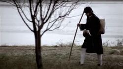 Nostradamus walks by a lake. Stock Footage