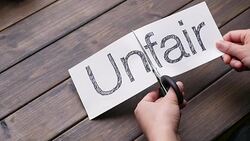 woman's hands cut paper by scissors on pattern wood plank Stock Footage