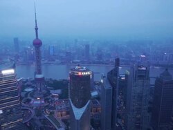 Pan shot, Pudong, Huangpu River, Oriental Pearl Tower, Shanghai International Finance Centre, day to night, skyline, city lights, streets, traffic, view from Jin Mao Tower, Shanghai, China Stock Footage