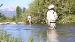 Two people fly fishing in Montana Stock Footage
